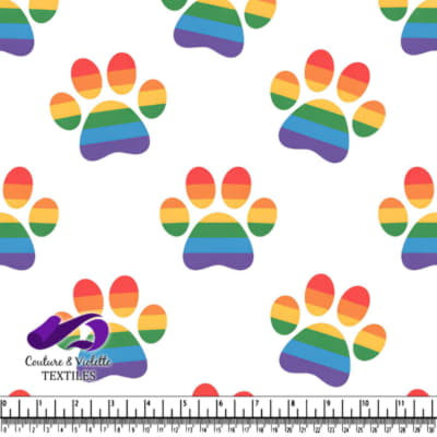 Colorful rainbow paw prints on white background