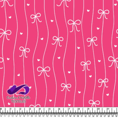 Pink fabric pattern with white bows and small hearts