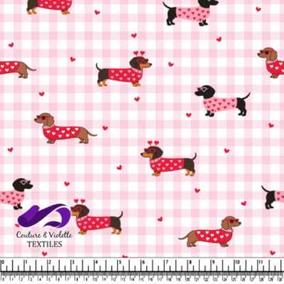 Dachshund Dogs in Heart Sweaters on Pink Checkered Background